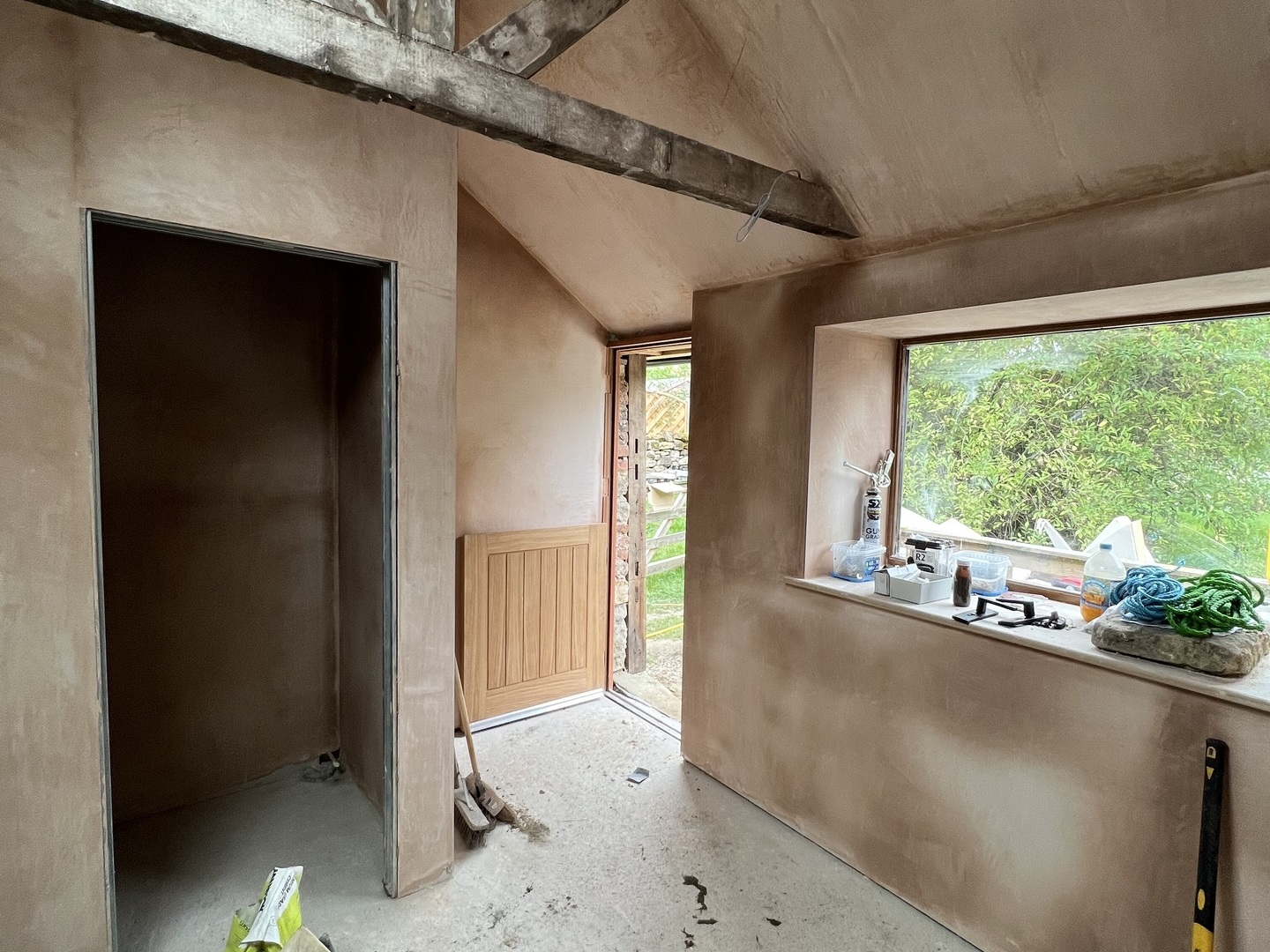 Stud walls and plastering complete.  Glazing fitted.